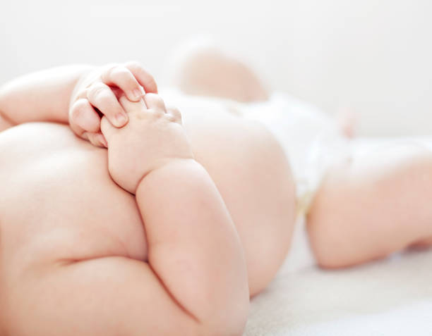 Baby Feet and Hands close-up stock photo