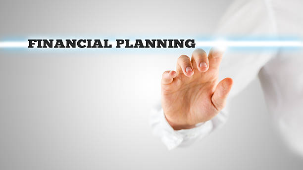 istock Finger Highlighting Financial Planning Words 518927327