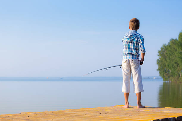 istock Boy in blue shirt standing on a pie 518928675