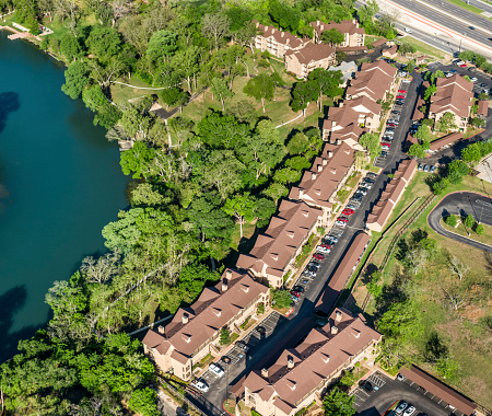 housing apartment complexes  on the Guadalupe Rive near New Braunfels, TX - Aerial view