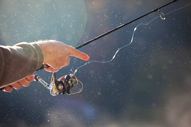 istock Man casting fishing reel 518929985