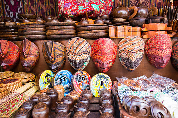 istock Masks and other artifacts in palm wood 518930221
