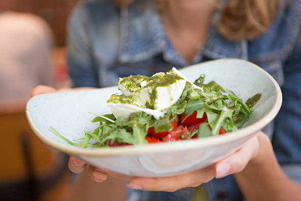 Woman showing salad