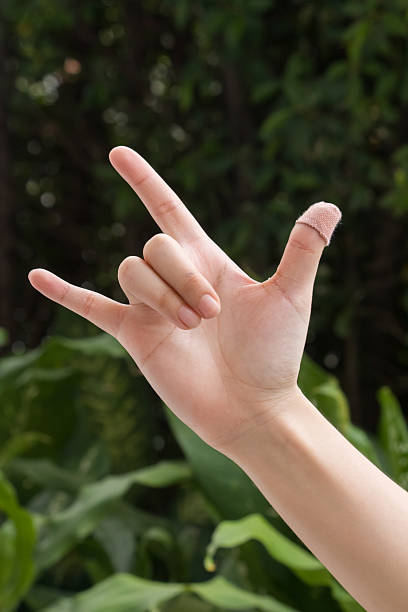istock hand showing love sign 518930423