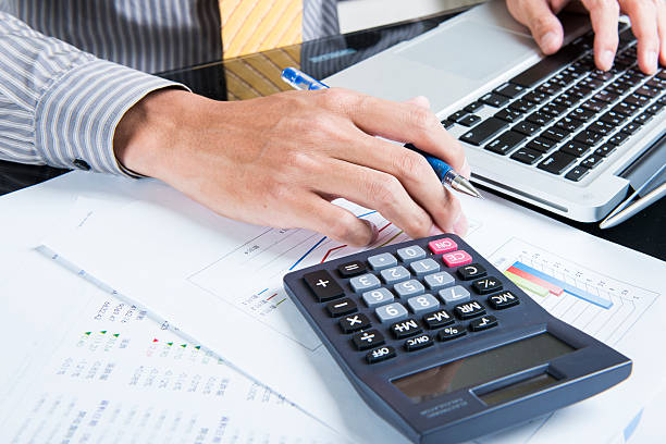 istock Businessman analyzing investment charts with laptop. Accounting 518930941