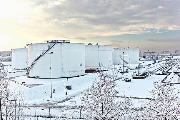 istock white tanks in tank farm with snow in winter 518943305