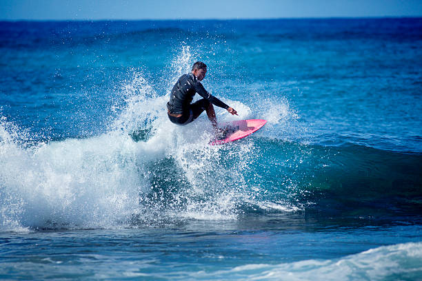 istock Surfer Making Turns on the Wave of Hawaii 518943697