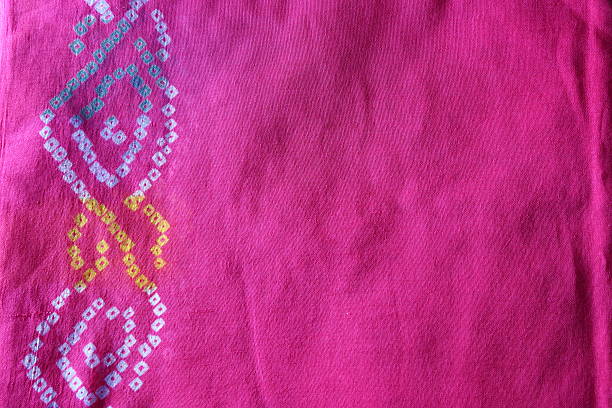 istock Indian bandhej saree cloth fabric texture 518944271
