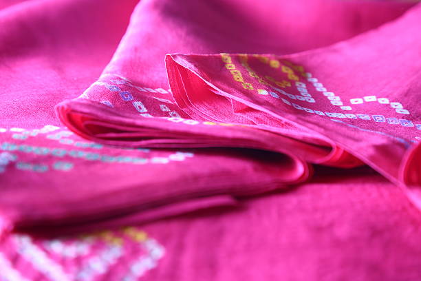 istock Indian bandhej saree cloth fabric texture 518946803