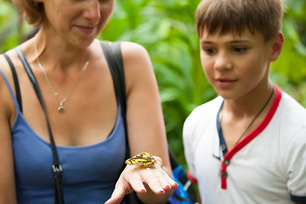 istock Mother and son with a butterfly 518948081