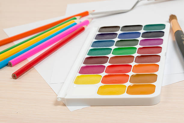 istock watercolor paints on the table next to the pencil 518948426