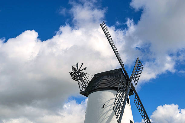 istock Windmill close up, with black sails and blue sky 518948640