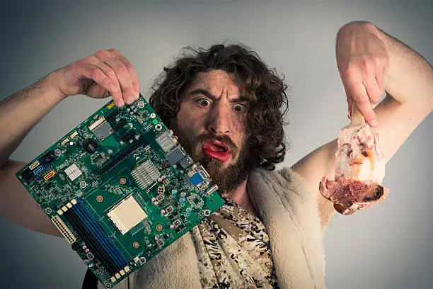 Silly confused caveman chooses between food and modern technology