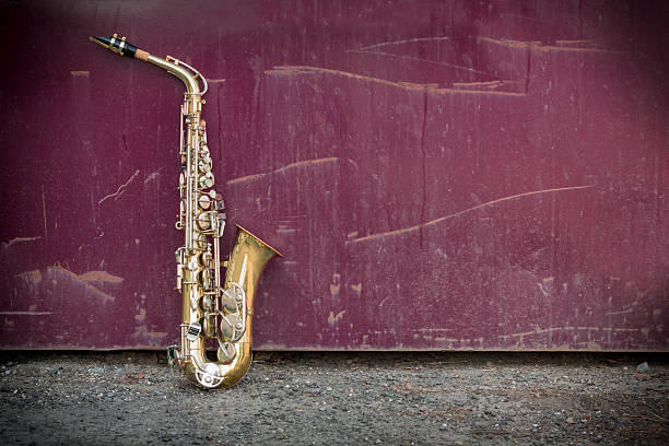 Jazz Saxophone Grunge Jazz musical instrument saxophone with grungy street background saxophone stock pictures, royalty-free photos & images