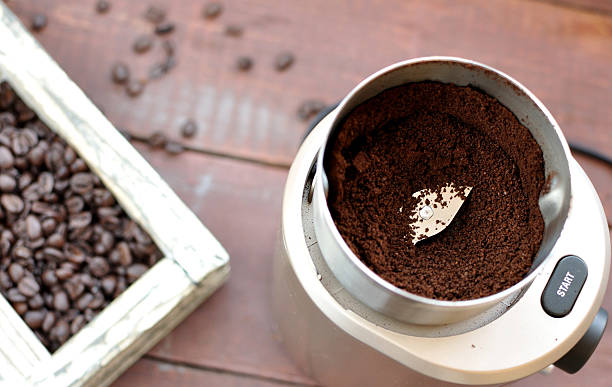 istock Electric coffee grinder with ground coffee 518950248