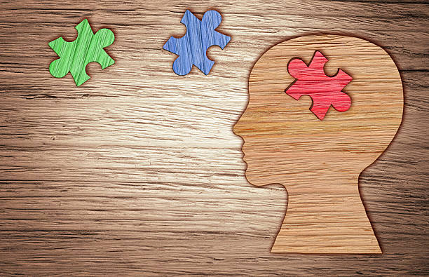 istock Human head silhouette, mental health symbol. Puzzle. 518951494
