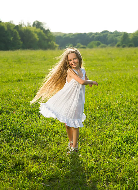 istock Girl playing in the field. 518951496