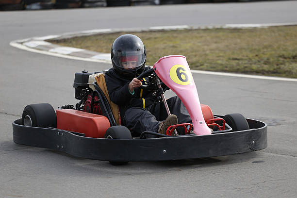 istock boy is driving Go-kart car with speed 518952398