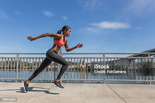 Attractive Ethnic Female Sprinter Training In The City Stock Photo - Download Image Now
