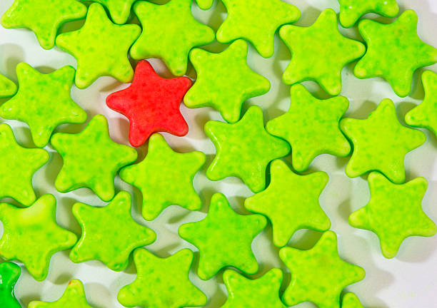 istock Red and green Star candies on white background 518953472