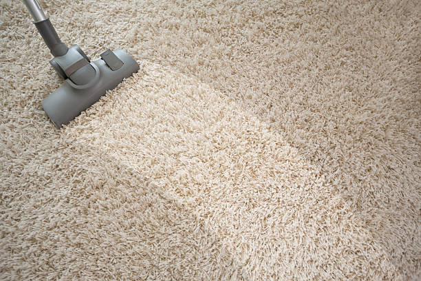 istock Vacuuming rough carpet with vacuum cleaner 518956158
