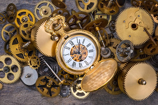 Pocket Watch and old Clock Parts - Cogs, gears, wheels Pocket watch and a selection of dusty old brass clock parts. broken pocket watch stock pictures, royalty-free photos & images