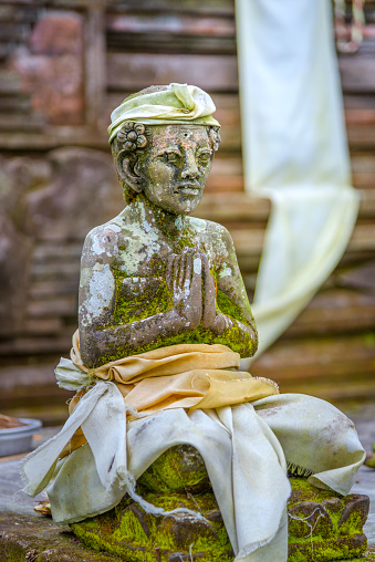 Balinese stone statue in Ubud temple, Bali