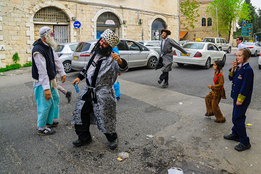 Jerusalem, Israel - March 25, 2016: Street scene, Breslov Hasidic Jews dance, in the ultra-orthodox neighborhood Mea Shearim, Jerusalem, Israel