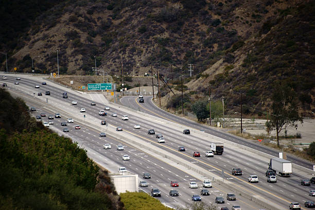 San Diego Freeway Los Angeles Traffic on the San Diego Freeway in Los Angeles with turn to the Getty Center. san diego freeway stock pictures, royalty-free photos & images