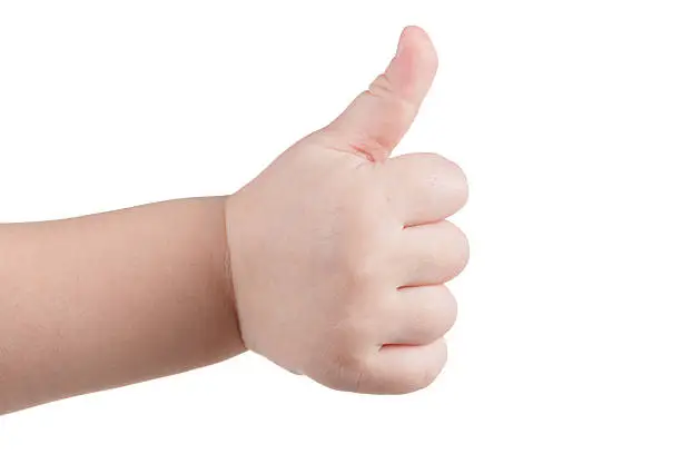 Approval thumbs up like sign, caucasian child hand gesture isolated over white background