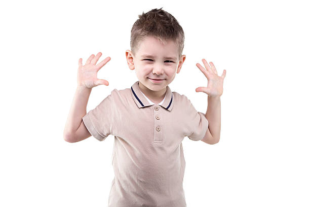 istock Little blond boy with hands up 518962216