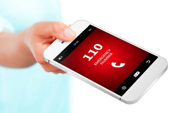 hand holding mobile phone with emergency number 110 hand holding mobile phone with emergency number 110 over 100 photos stock pictures, royalty-free photos & images