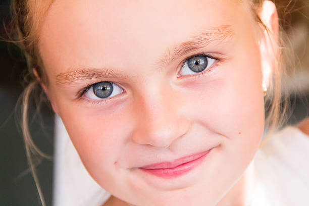 istock Cute girl with big blue eyes 518977133