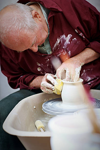 istock Senior adult making pottery 518978065
