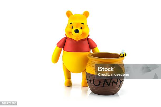 Figure Of Winnie The Pooh And Hunny Pot Stock Photo - Download Image Now - Winnie The Pooh, Bear, Bee