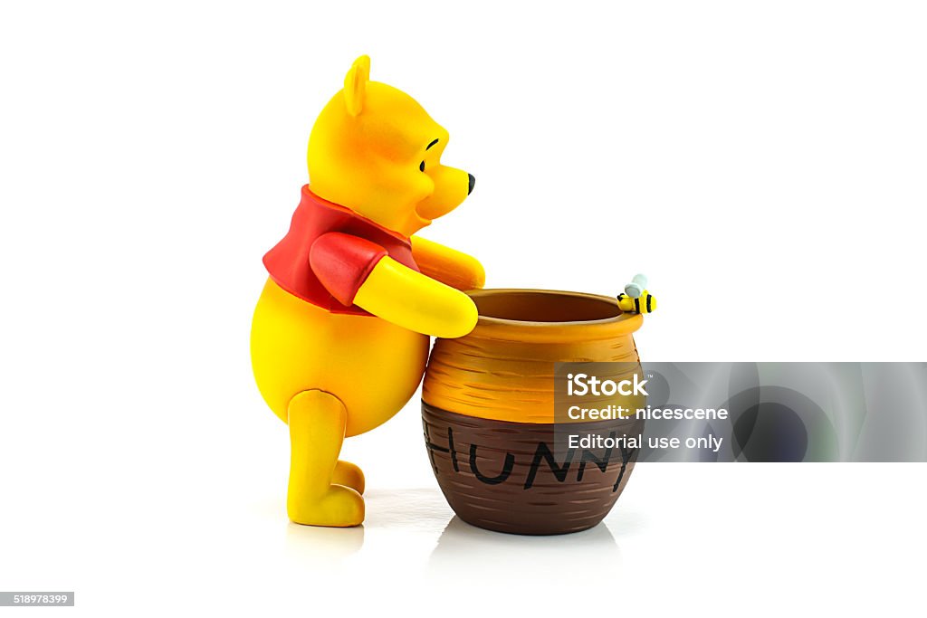 Figure Of Winnie The Pooh And Hunny Pot Stock Photo - Download