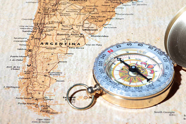 istock Travel destination Argentina, ancient map with vintage compass 518978785