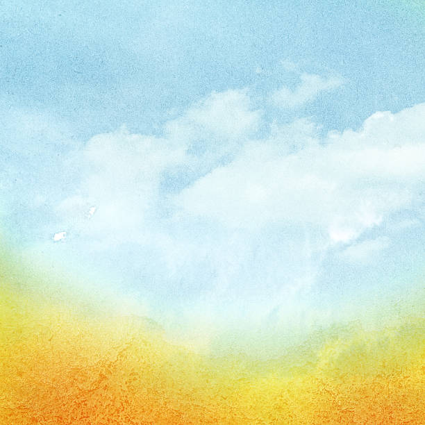 istock Cloudy watercolor sky with orange sun rays. 518978841