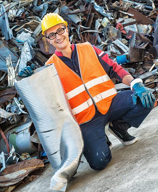 istock Smiling Worker in Metal Landfill 518980095