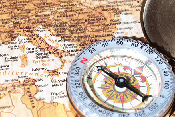 istock Travel destination Italy, ancient map with vintage compass 518982733