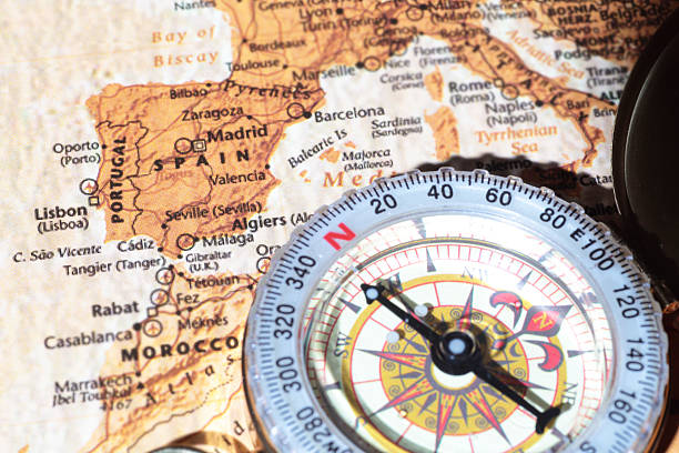 istock Travel destination Spain, ancient map with vintage compass 518982735