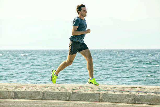 istock running outdoor on pavement seaside 518983157