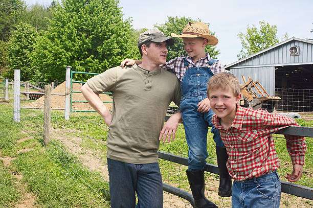 istock Father and sons on farm 519001960
