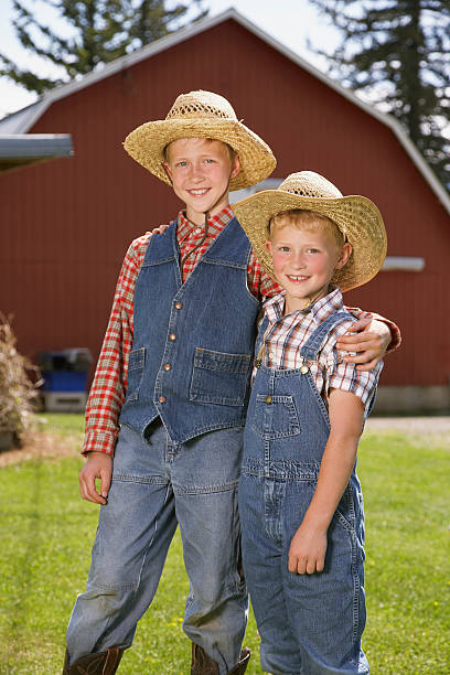 istock Brothers in front of barn 519002060