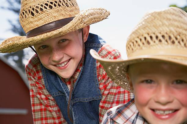 istock Two boys wearing straw hats 519004180
