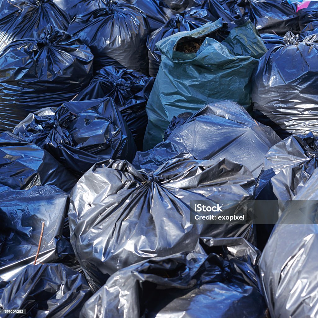 Pile of full garbage bags Fragment of a pile of black plastic garbage bags Bag Stock Photo