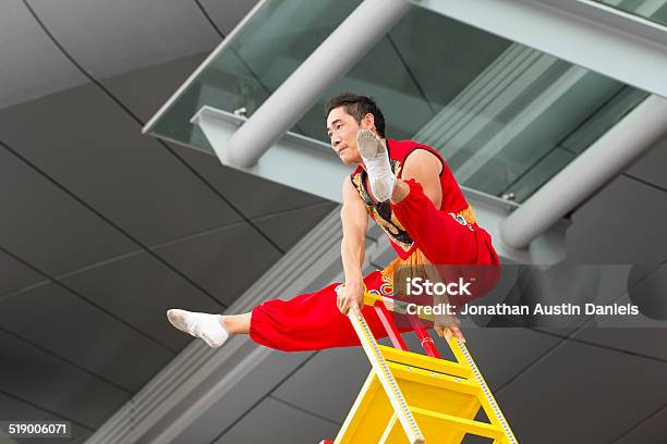 Acrobat Performing Stock Photo - Download Image Now - 2014, Acrobat, Acrobatic Activity