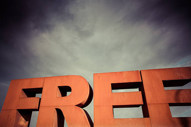 Capital letters FREE with cloudy sky