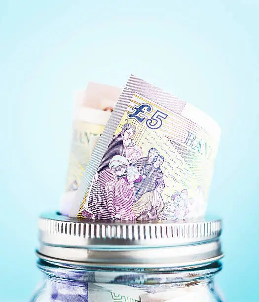 British currency in donation or savings jar