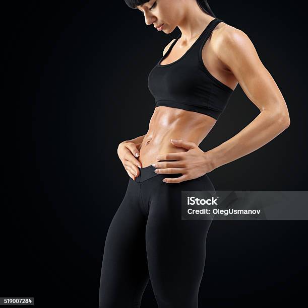 Close Up Of Woman Body Strong Abs Showing Stock Photo - Download Image Now - Adult, Anaerobic Exercise, Athlete